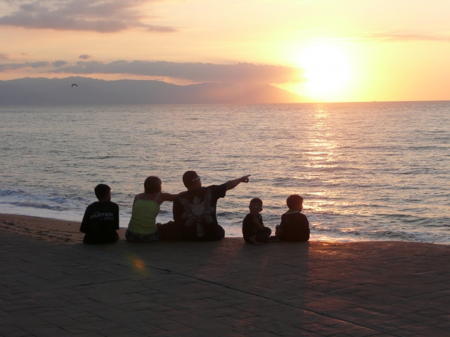 Family enjoying the sunset on Banderas Bay
