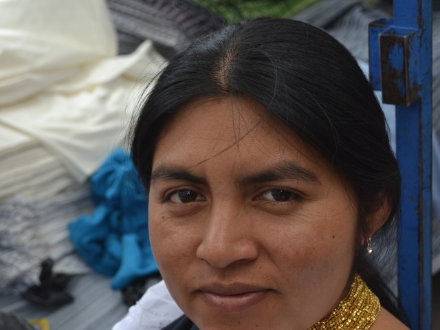 Lady selling wares in Otavalo Marketplace